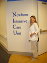 Jen showing off her pregnant stomach at the St. Louis Children's Hospital NICU where Jen was after she was born.